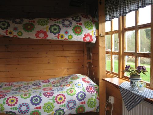 Ένα ή περισσότερα κρεβάτια σε δωμάτιο στο Yxningens Holiday Homes, Cottages and Camping