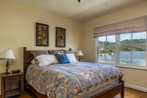 a bedroom with a bed and a window at 28 San Miguel in Avila Beach