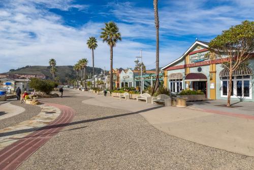 a street in a town with palm trees and buildings at 28 San Miguel in Avila Beach