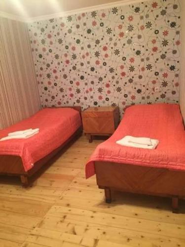 Una cama o camas en una habitación de Guesthouse Buba Mestia