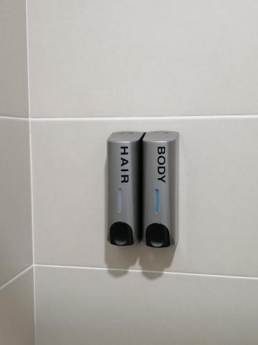 twointendo wii controllers sitting on a tile wall at A&D Home-stay @Kota Warisan, Sepang (KLIA 15 min) in Sepang