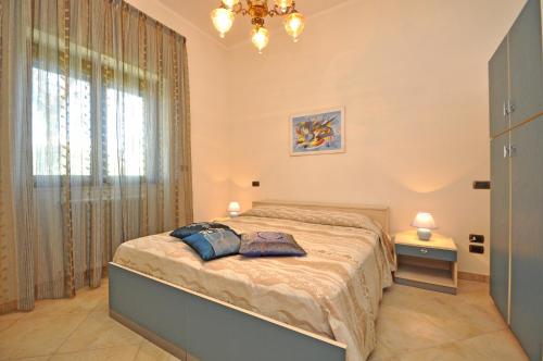 Ліжко або ліжка в номері Villa Marechiaro by Salento Affitti