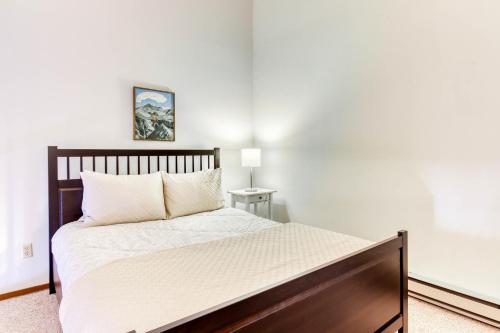 a bedroom with a large bed with white sheets at Elkhorn Escape in Sun Valley