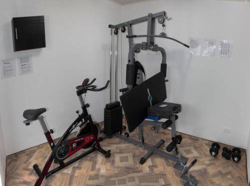 a room with a gym with a exercise bike at Hotel Zaclordy in Ubaté