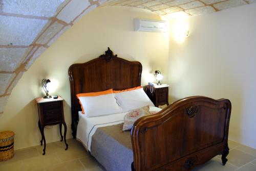 Postel nebo postele na pokoji v ubytování Palazzo Mellacqua
