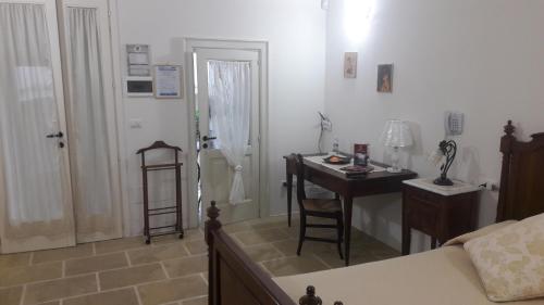Ένα ή περισσότερα κρεβάτια σε δωμάτιο στο Palazzo Mellacqua