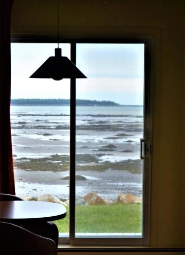 a view of the ocean from a window at Motel Rimouski in Rimouski