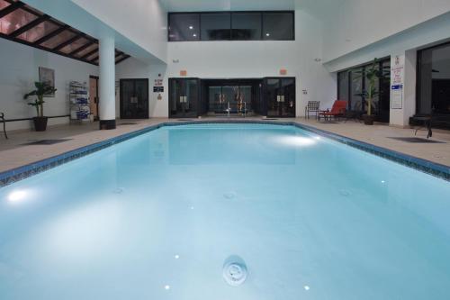 a large swimming pool in a building at Crowne Plaza Hotel Virginia Beach-Norfolk, an IHG Hotel in Virginia Beach