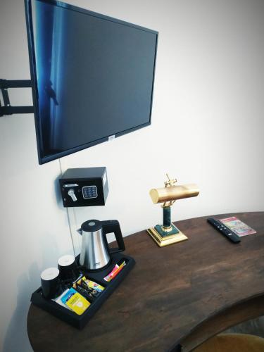 TV a/nebo společenská místnost v ubytování Colmar Suites - Résidence