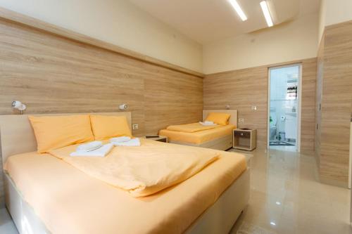 Ένα ή περισσότερα κρεβάτια σε δωμάτιο στο Apartman UZOR