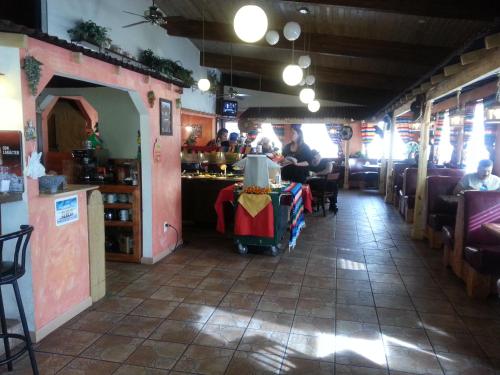a restaurant with people sitting at a table at Casa Lemus Inn in Raton