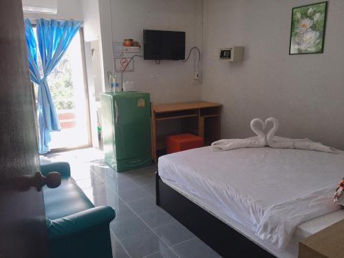 Postel nebo postele na pokoji v ubytování Jenny Hostel HuaHin