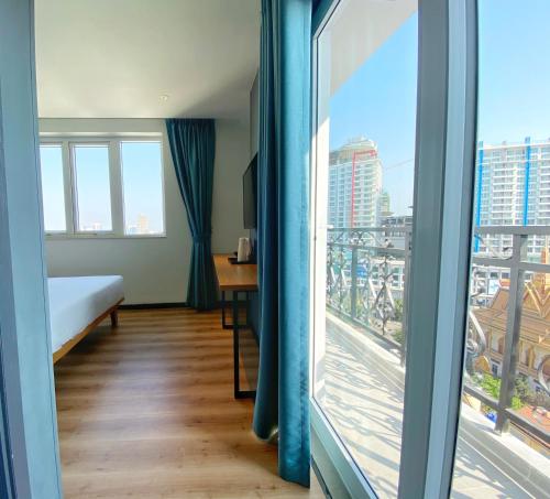 Postel nebo postele na pokoji v ubytování Yunfan Hotel