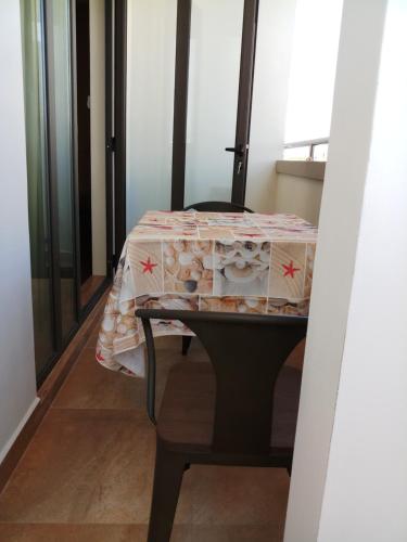 a table with a table cloth on top of it at The Monalysa Suites & Residence in Grand Baie