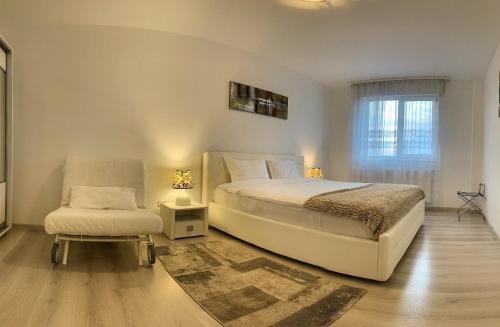Ένα ή περισσότερα κρεβάτια σε δωμάτιο στο Panorama by Pipera Lake Apts.