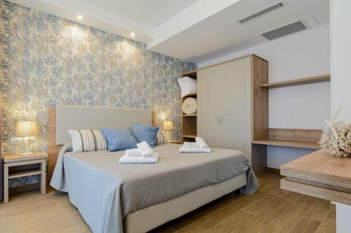 Postelja oz. postelje v sobi nastanitve Hotel Serenella