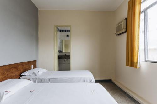 Una cama o camas en una habitación de Hotel Líder