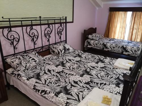 Кровать или кровати в номере Гостиница "Никольская"