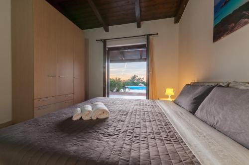 Кровать или кровати в номере Resort Gravina - Costa Paradiso