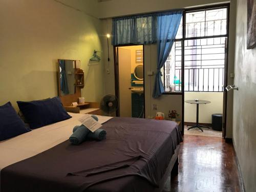 
Cama o camas de una habitación en Wayside Guesthouse
