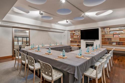 a conference room with a long table and chairs at Vincci Soma in Madrid