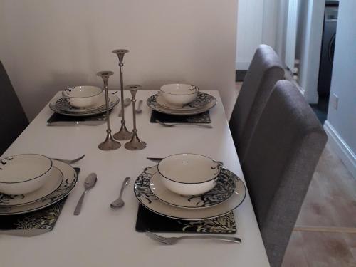 a table with dishes and spoons on top of it at Demesnes View in Barnard Castle