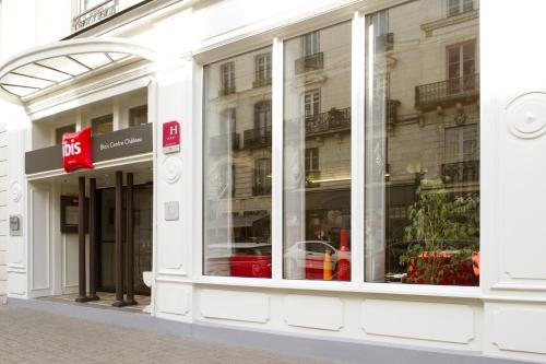 a store front with glass windows on a street at ibis Blois Centre Château in Blois