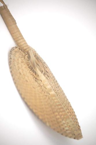 a brown feather sitting on top of a white background at La Due Thulusdhoo in Thulusdhoo