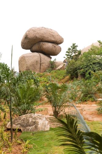 a stack of rocks sitting on top of a hill at Hyatt Hyderabad Gachibowli in Hyderabad