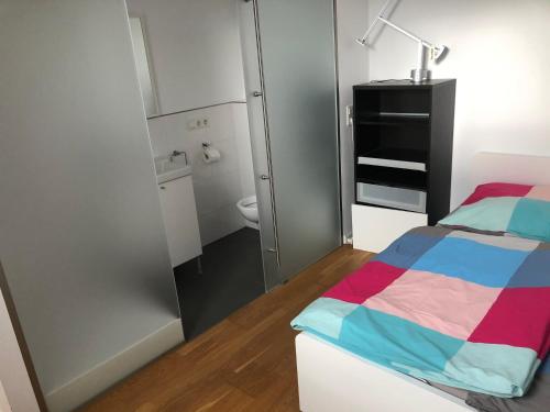 Ένα ή περισσότερα κρεβάτια σε δωμάτιο στο Ferienhaus Mainz