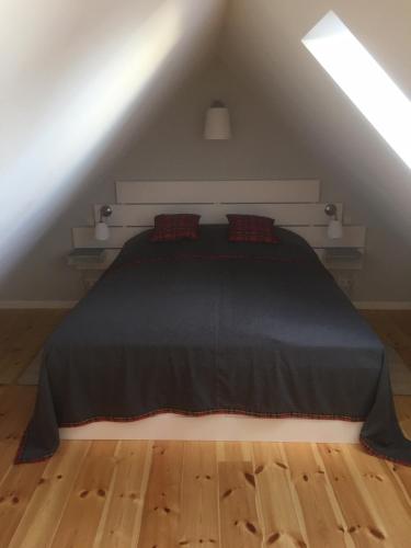Ένα ή περισσότερα κρεβάτια σε δωμάτιο στο Altstadt-Ferienwohnungen Neuruppin