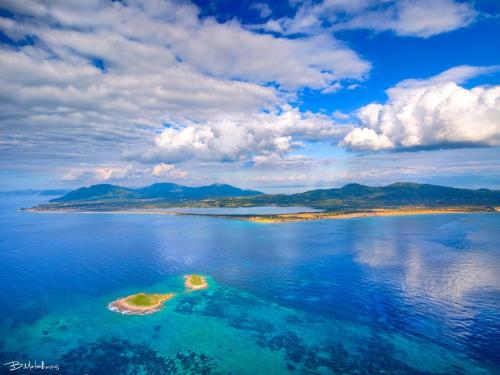 an island in the middle of a large body of water at Christinas lofts in Ágios Matthaíos