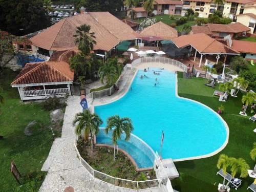 an aerial view of a swimming pool at a resort at Ste Anne Martinique Studio bord de mer Résidence Anse Caritan in Sainte-Anne
