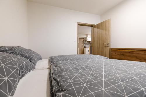 Postel nebo postele na pokoji v ubytování Apartmán NESS