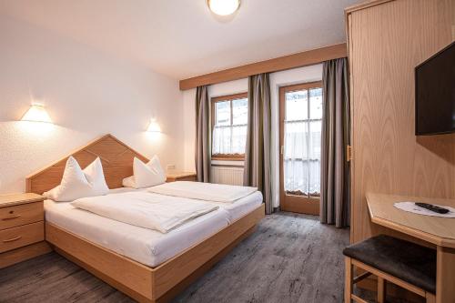 Ένα ή περισσότερα κρεβάτια σε δωμάτιο στο Haus Markus