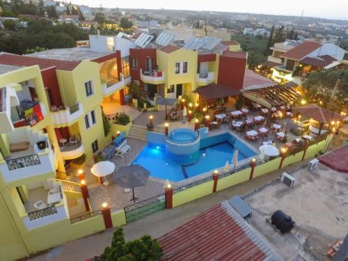 an aerial view of a building with a swimming pool at Ariadni Palace in Hersonissos
