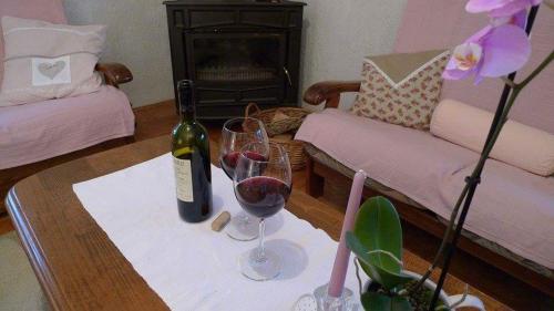 a living room with a table with two glasses of wine at Apartment ''Ane'' in Kruševo
