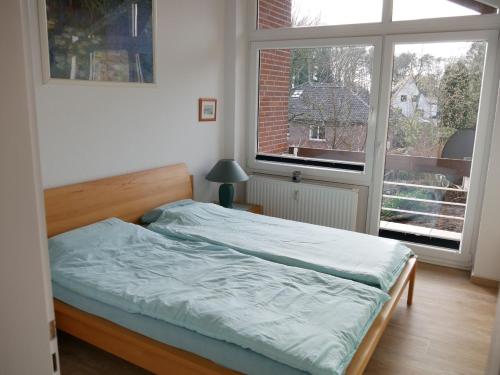 Ein Bett oder Betten in einem Zimmer der Unterkunft Ferienwohnung Haus Sonnenberg