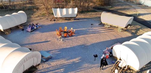 an overhead view of a stage with people sitting around tables at Orr Family Farm & RR, LLC in Oklahoma City