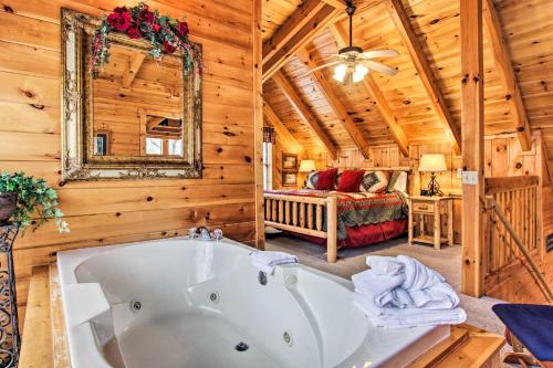 a bathroom with a bath tub in a cabin at Gatlinburg Mountainside Escape with Deck and Hot Tub! in Gatlinburg