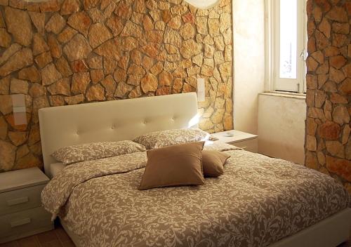 Säng eller sängar i ett rum på B&b Vittorio Emanuele II