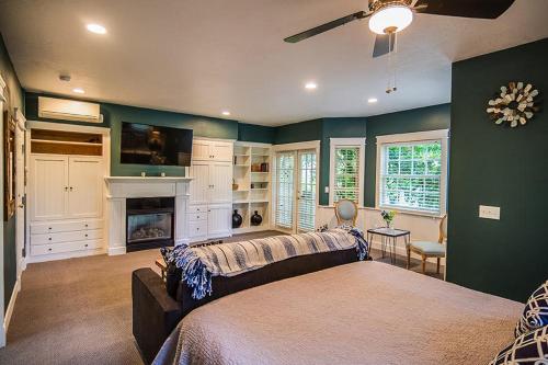 a living room with a couch and a fireplace at The Campbell House Inn in Eugene