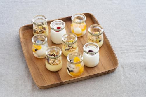 a tray of eggs in glass jars on a table at Vessel Inn Keisei Tsudanuma Station in Narashino