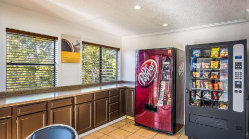 a coca cola vending machine in a room at Motel 6-Hot Springs, AR in Hot Springs