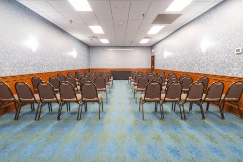a conference room with a bunch of chairs in it at Holiday Inn Louisville East - Hurstbourne by IHG in Louisville