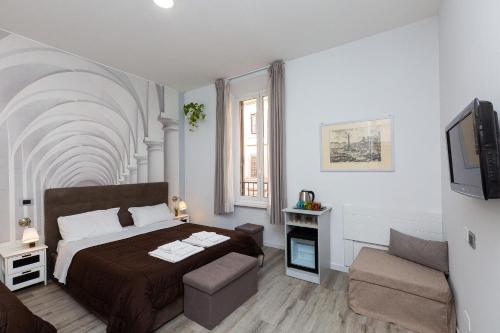 Ένα ή περισσότερα κρεβάτια σε δωμάτιο στο Termini Central Inn