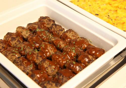 a plastic container filled with meatballs and sauce at Urban Hotel Minami Kusatsu in Kusatsu