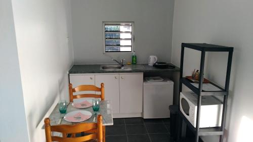 Kuchyň nebo kuchyňský kout v ubytování Jambolana Studio