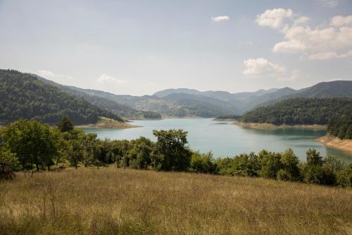 a view of a lake in the mountains at Apartments&Camping ZIP in Kremna