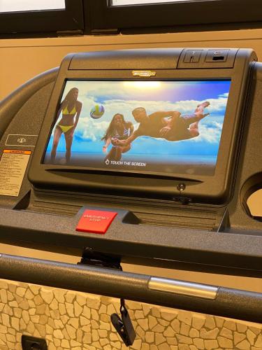 a computer monitor with a picture of people on it at Art & Hotel Aeroporto in Stezzano